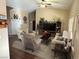Cozy living room with vaulted ceilings, ceiling fan, and plush furniture at 574 Desert Tortoise Way, Mesquite, NV 89027
