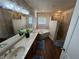 Well-lit bathroom with dual sinks, separate tub, and tiled walk-in shower at 574 Desert Tortoise Way, Mesquite, NV 89027
