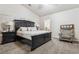 A spacious main bedroom boasts plush carpet, neutral tones, and a charming sitting area at 574 Desert Tortoise Way, Mesquite, NV 89027