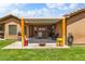 Covered patio with outdoor seating and a fire pit at 574 Desert Tortoise Way, Mesquite, NV 89027