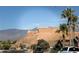 Street view featuring mountain backdrop and well-maintained homes at 574 Desert Tortoise Way, Mesquite, NV 89027