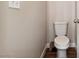 Standard toilet with white baseboard trim and neutral wall paint at 574 Desert Tortoise Way, Mesquite, NV 89027