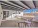 Relaxing back patio with a covered structure and outdoor seating area at 6553 Baywood Ave, Las Vegas, NV 89103