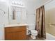 Bathroom featuring a shower-tub combo with shower curtain, vanity, and functional fixtures at 6553 Baywood Ave, Las Vegas, NV 89103