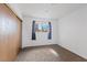 Bedroom featuring a window with curtains and a closet with light wood sliding doors at 6553 Baywood Ave, Las Vegas, NV 89103
