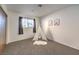 Cozy bedroom with soft carpet, natural light, and playful decor at 6553 Baywood Ave, Las Vegas, NV 89103