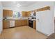 Functional kitchen with stainless steel sink and appliances, and light wood cabinets at 6553 Baywood Ave, Las Vegas, NV 89103