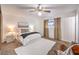 Comfortable carpeted main bedroom with a ceiling fan, window, and neutral decor at 6553 Baywood Ave, Las Vegas, NV 89103