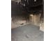 Burned bedroom featuring charred walls, damaged flooring, and remnants of exposed framing at 709 G St, Las Vegas, NV 89106