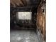 Destroyed bedroom featuring charred walls, exposed framing and window with substantial fire damage at 709 G St, Las Vegas, NV 89106