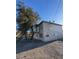 Two-story exterior showing the side and the surrounding arid landscape on a sunny day at 709 G St, Las Vegas, NV 89106