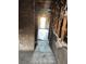 Damaged hallway featuring ruined walls, with water damage, peeling paint, and tiled flooring at 709 G St, Las Vegas, NV 89106
