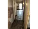 Hallway featuring tile flooring leading to a bright doorway at 709 G St, Las Vegas, NV 89106