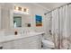 Bright bathroom featuring a white vanity, framed mirror, and shower with unique curtain at 7197 Sixshooter Dr, Las Vegas, NV 89119