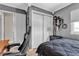 Inviting bedroom featuring a black gaming chair and ample closet storage at 7197 Sixshooter Dr, Las Vegas, NV 89119