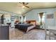 Serene bedroom with unique flooring, mirrored closet, and soft lighting for a restful ambiance at 7197 Sixshooter Dr, Las Vegas, NV 89119