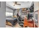 A cozy gray bedroom with a ceiling fan, complete with a computer setup for gaming and studying at 7197 Sixshooter Dr, Las Vegas, NV 89119