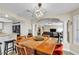 Bright dining area with stylish table and chairs, modern lighting, and French doors at 7197 Sixshooter Dr, Las Vegas, NV 89119