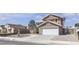 Charming two-story home with a well-manicured yard, a two-car garage and elegant front yard landscaping at 7197 Sixshooter Dr, Las Vegas, NV 89119