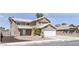 Attractive two-story home with a two-car garage and elegantly landscaped front yard at 7197 Sixshooter Dr, Las Vegas, NV 89119