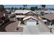Charming two-story home features a well-maintained yard, two car garage and a driveway at 7197 Sixshooter Dr, Las Vegas, NV 89119