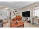 Bright living room with tile flooring, neutral paint, and lots of seating options at 7197 Sixshooter Dr, Las Vegas, NV 89119