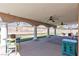 Spacious covered patio with ceiling fans, perfect for relaxing and entertaining outdoors at 7197 Sixshooter Dr, Las Vegas, NV 89119