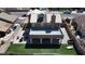 A charming home featuring a patio, a backyard with a manicured lawn, and elegant landscaping at 7197 Sixshooter Dr, Las Vegas, NV 89119
