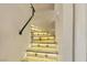 Stairway with tile steps with inset tile design and integrated step lighting at 7197 Sixshooter Dr, Las Vegas, NV 89119
