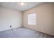 A bright bedroom featuring neutral carpet and a window at 7517 Crested Moon St, North Las Vegas, NV 89084