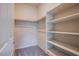 Well-organized walk-in closet with shelving for ample storage at 7517 Crested Moon St, North Las Vegas, NV 89084