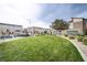 Well-maintained common area featuring lush landscaping, seating, and green space at 7517 Crested Moon St, North Las Vegas, NV 89084