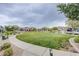 Well-maintained common area featuring lush landscaping and walking paths at 7517 Crested Moon St, North Las Vegas, NV 89084