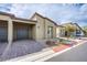 Contemporary home with desert landscaping, brick driveway, and a two-car garage at 7517 Crested Moon St, North Las Vegas, NV 89084