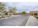 Gated community entrance with well-maintained landscaping and modern homes at 7517 Crested Moon St, North Las Vegas, NV 89084