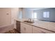 Kitchen island features a stainless steel sink, dishwasher and granite countertops at 7517 Crested Moon St, North Las Vegas, NV 89084