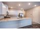 Kitchen features a large island with granite countertops and stainless-steel appliances at 7517 Crested Moon St, North Las Vegas, NV 89084