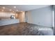 Open-concept living room features wood floors that lead into the kitchen at 7517 Crested Moon St, North Las Vegas, NV 89084