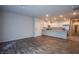 Open-concept living room features wood floors and connects to the kitchen at 7517 Crested Moon St, North Las Vegas, NV 89084