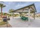 Outdoor picnic area with a covered gazebo and grill, ideal for Gathering gatherings and barbecues at 7517 Crested Moon St, North Las Vegas, NV 89084