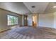 Large bedroom with neutral carpet, ample natural light, and walk-in closets at 7900 Dutch Canyon Ct, Las Vegas, NV 89131