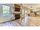 Spacious living room with a fireplace, open floor plan, and bright natural light at 7900 Dutch Canyon Ct, Las Vegas, NV 89131