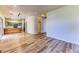Open-concept living area with hardwood floors adjoining the kitchen featuring a wooden island at 7900 Dutch Canyon Ct, Las Vegas, NV 89131