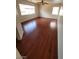 Bedroom featuring laminate floors, ceiling fan, and well lit windows at 8149 Palace Monaco Ave, Las Vegas, NV 89117