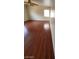 Bright bedroom with hardwood flooring, fan, and natural light from two windows at 8149 Palace Monaco Ave, Las Vegas, NV 89117