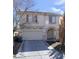 Charming two-story home with well-maintained landscaping, attached two-car garage and inviting arched entryway at 8149 Palace Monaco Ave, Las Vegas, NV 89117