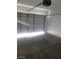 A standard two car garage with bright overhead lighting at 8149 Palace Monaco Ave, Las Vegas, NV 89117