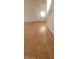 Bright living room featuring neutral walls and pristine hardwood floors at 8149 Palace Monaco Ave, Las Vegas, NV 89117