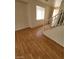 Bright living area featuring hardwood floors, staircase and a view to the entry way at 8149 Palace Monaco Ave, Las Vegas, NV 89117