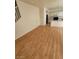 Spacious living room with hardwood floors leading to an open kitchen and entry way at 8149 Palace Monaco Ave, Las Vegas, NV 89117
